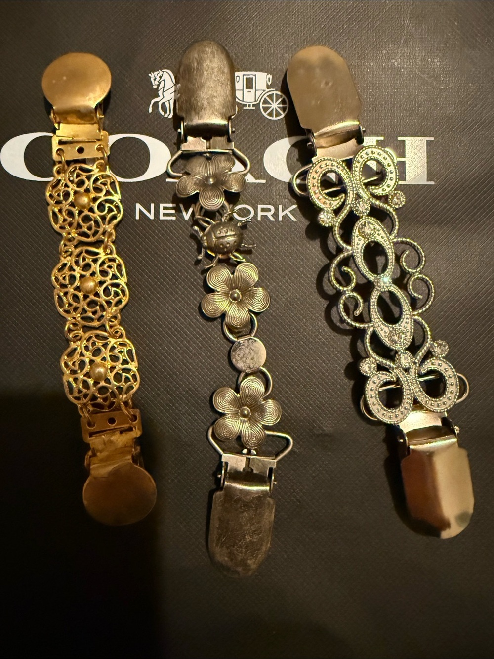 Coach Women's Gold and Silver Decorative Bracelet Set